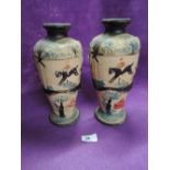 A pair of ceramic vase with hand painted relief of fox hunt in persuit