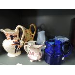 A selection of vintage jugs including blue glass