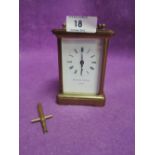 A vintage carriage clock by Mathew Norman London with brass and cut glass