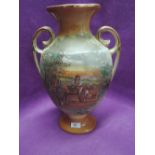 A large vintage urn style vase with wagon print and twin handle