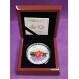 A 2016 Canadian 50 dollar fine silver coin (Murano Maple Leaf Autumn Radiance) weight 157.6 grams,
