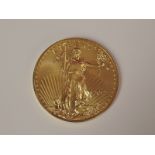 A gold 1oz 2013 50 dollar U.S.A. coin, in plastic case