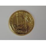 A gold 1oz 2015 Great Britain Britannia 100 pound coin, in plastic case