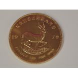 A gold 1oz 1979 South African Krugerrand coin, in plastic case