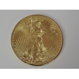 A gold 1oz 2010 50 dollar U.S.A. coin, in plastic case