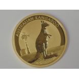 A gold 1oz 2012 100 dollar Australian Kangaroo coin, in plastic case