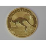 A gold 1oz 2015 100 dollar Australian Kangaroo coin, in plastic case