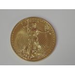 A gold 1oz 2016 50 dollar U.S.A. coin, in plastic case