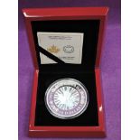 A 2015 Canadian silver 5oz hologram Maple leaf 50 dollar coin, in wood case with certificate