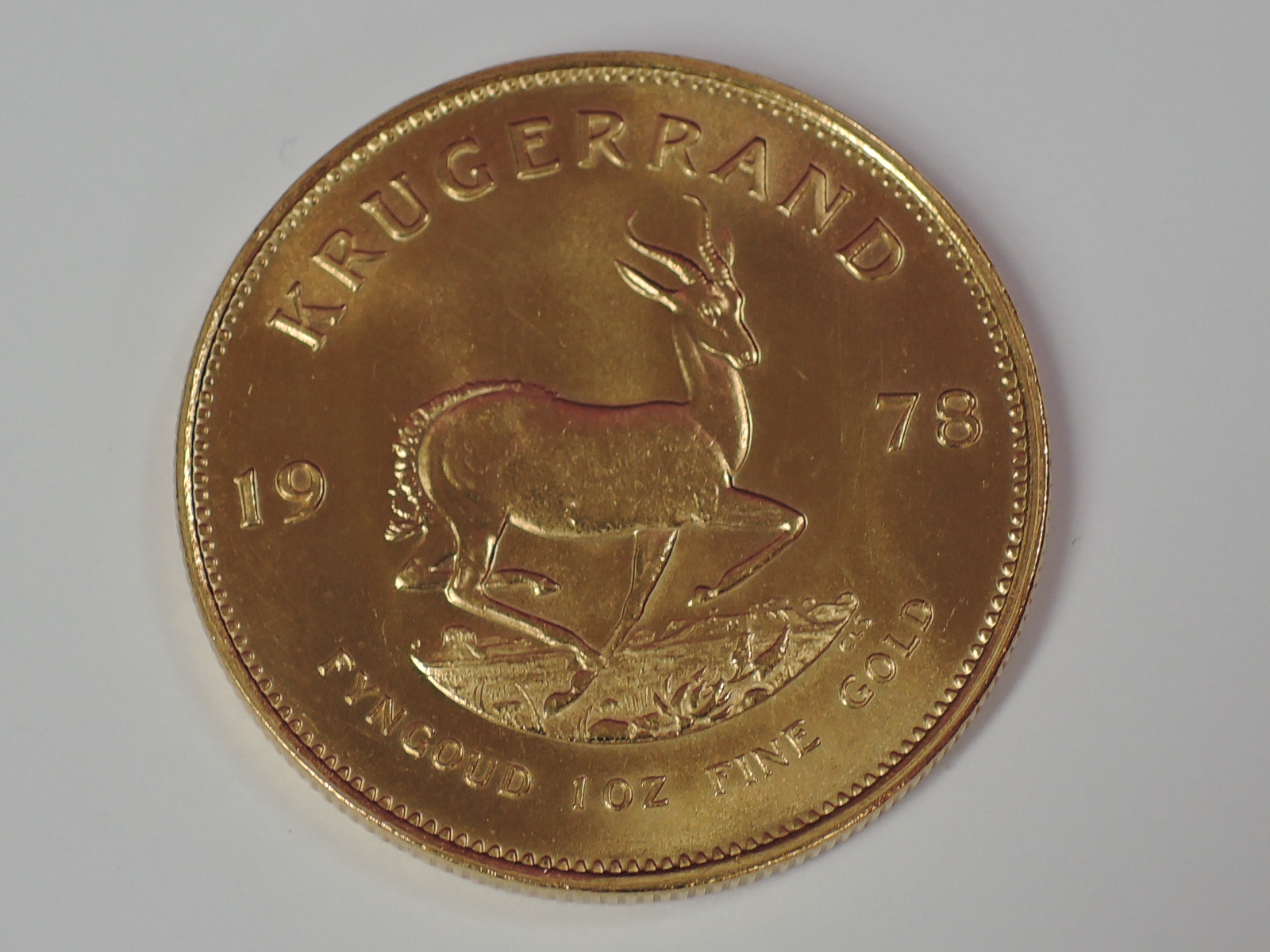 A gold 1oz 1978 South African Krugerrand coin, in plastic case