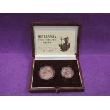 A gold UK 1987 Britannia two coin proof set that features a £25 coin that contains 1/4 of an ounce