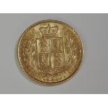 A gold 1869 Great Britain Victoria, young head, shield back Sovereign with die number 45 below