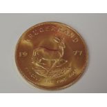 A gold 1oz 1977 South African Krugerrand coin, in plastic case