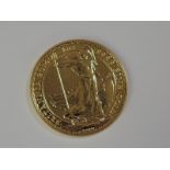 A gold 1oz 2016 Great Britain Britannia 100 pound coin, in plastic case