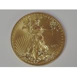A gold 1oz 2012 50 dollar U.S.A., coin in plastic case