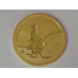 A gold 1oz 2009 100 dollar Australian Kangaroo coin, in plastic case