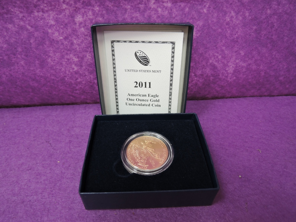 A gold 2011 United States of America 50 dollar, on ounce, uncirculated coin, in a case with