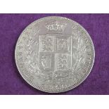 A 1877 Queen Victoria half crown in uncirculated or nearly uncirculated condition
