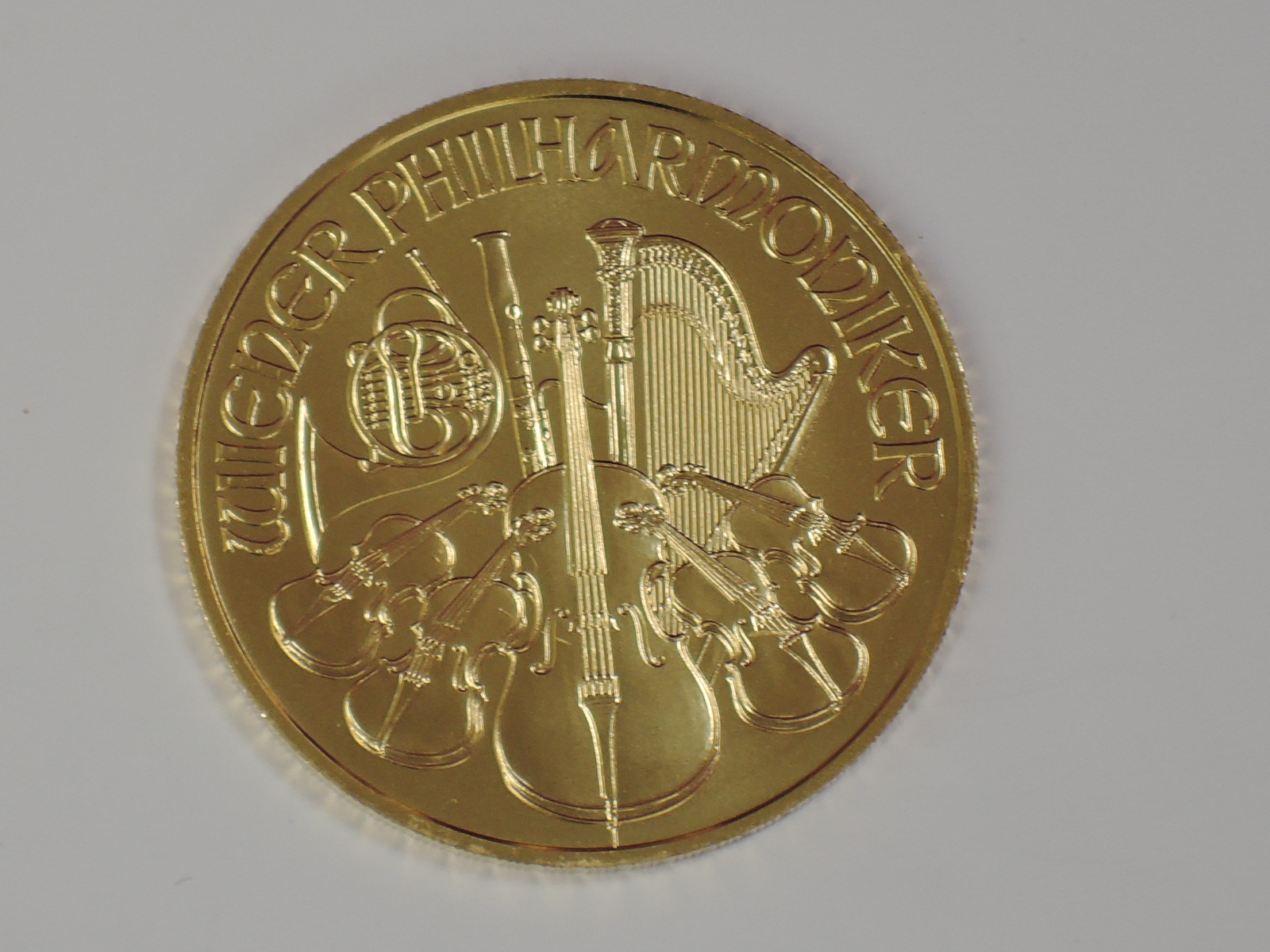 A gold 1oz 2017 Austria 100 Euro Winer Philharmoniker coin, in plastic case