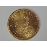 A gold 1oz 1982 South African Krugerrand coin, in plastic case