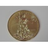 A gold 1oz 2015 50 dollar U.S.A. coin, in plastic case