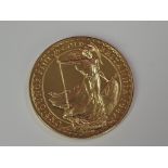A gold 1oz 1987 Great Britain Britannia 100 pound coin, in plastic case
