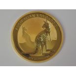 A gold 1oz 2016 100 dollar Australian Kangaroo coin, in plastic case