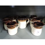 A selection of vintage earthern ware style mugs and jug