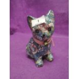 A modern figurine of a kitten with a fabric pattern style finish