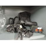 A selection of vintage binoculars including Tecnar Swift 8x40