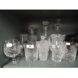 A selection of vintage clear cut crystal and leaded glass wares including decanters