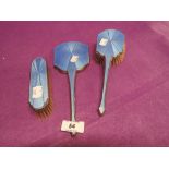 A vintage dressing table set with blue enamel backed finish