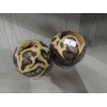 Two spherical semi precious stone decorations with visible inner