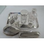 A seven piece silver dressing table set consisting of two brushes, cut glass perfume bottle with