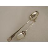 A Georgian silver basting spoon of hanovarian form, London 1805, Thomas Wallis II, and a possible