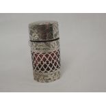 An Edwardian silver scent phial of cylindrical form having engraved scroll and pierced decoration,