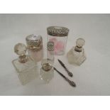 Six glass dressing table pots and bottles having HM silver collars and lids