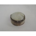 An Edwardian silver trinket box of circular form having mother of pearl inset to hinged lid,