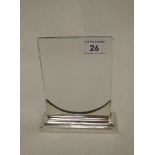 An Art Deco style silver photograph frame having a silver stand and double glass photograph