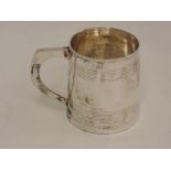 A Georgian silver christening tankard having reeded band decoraion and moulded handle, London