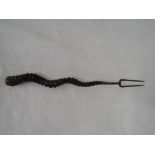 A 19th century two pronged white metal toasting fork with twisted antelope horn handle, no marks