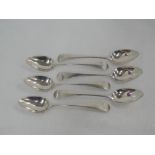 A set of six Georgian silver teaspoons of hanoverian form monogrammed HMS to terminals, London 1802,