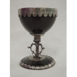 A Victorian coconut goblet in the 18th century style having white metal rim, decorative stem and