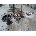 A collection of garden pot stands, planters etc