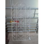 A wrought iron garden gate