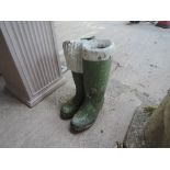 A pair of concrete welly planters