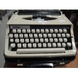 A vintage portable typewriter by Brother Deluxe 800