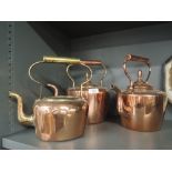 A selection of vintage copper and brass kettles