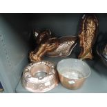 A selection of vintage copper pressed desert moulds