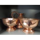 A selection of vintage copper items including pair of footed bowls